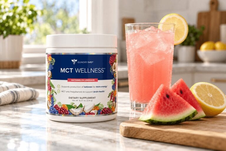 Jar of MCT Wellness Watermelon Lemonade by Gundry MD beside a glass of watermelon lemonade